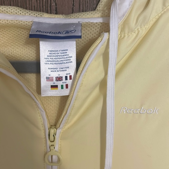 Pale yellow vintage Reebok raincoat. - Picture 2 of 5